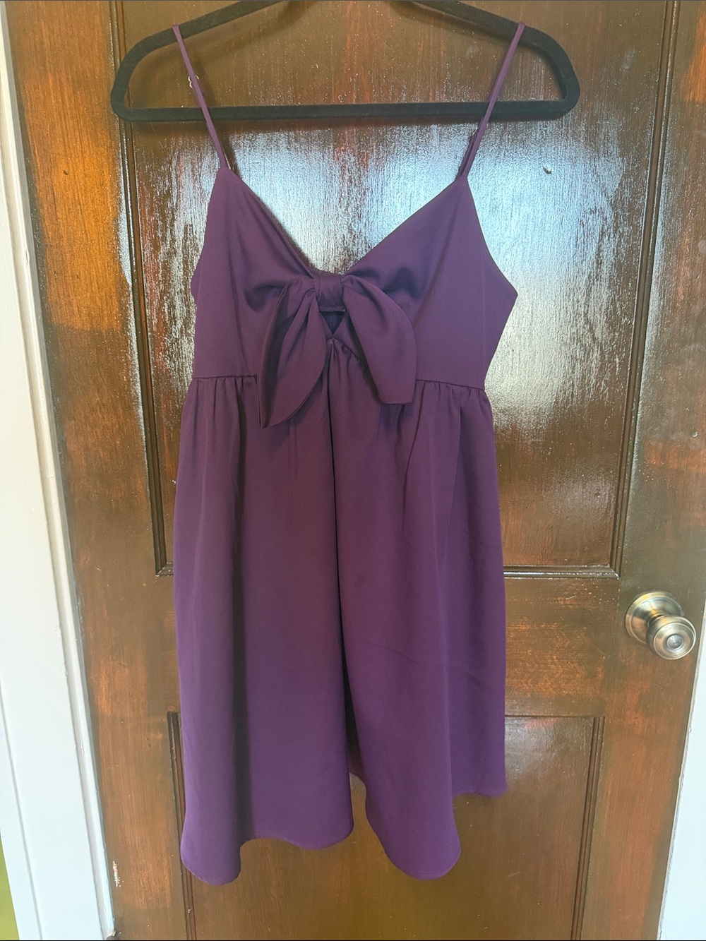 Purple dress with bow detail and pockets